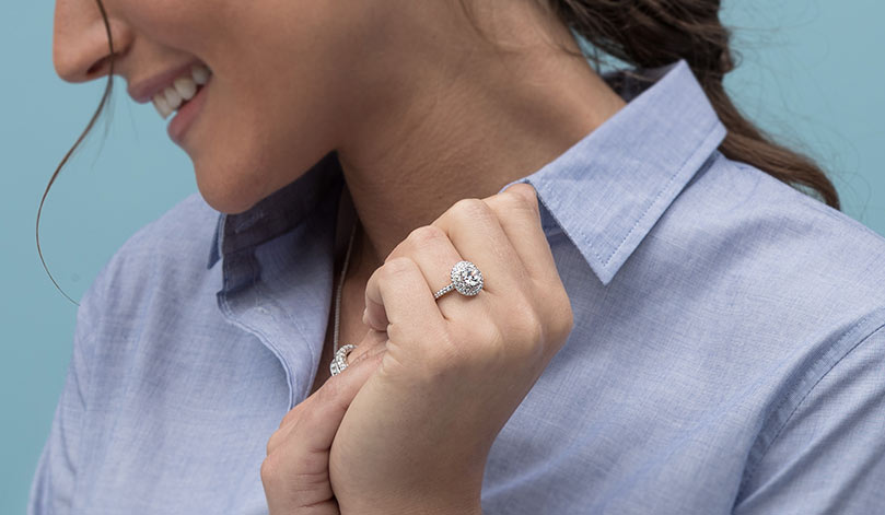 a woman wearing a halo ring