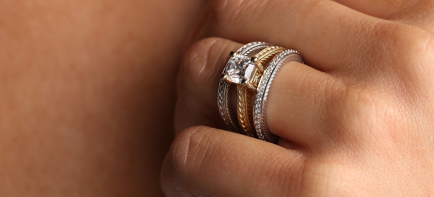 wedding band and engagement rings stacked