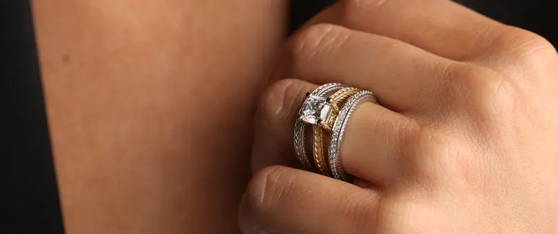 engagement and wedding rings stacked